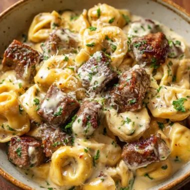 Garlic steak tortellini in a rustic bowl ready to be served