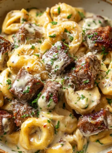 Garlic steak tortellini in a rustic bowl ready to be served