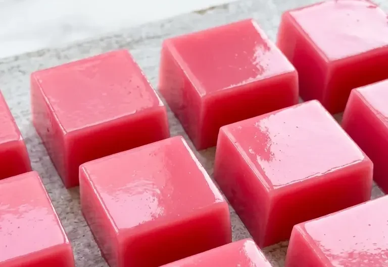Pinterest pin image for Dr Oz pink gelatin recipe showing silky pink gelatin squares
