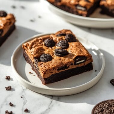 Slutty brownies with cookie dough showing three decadent layers