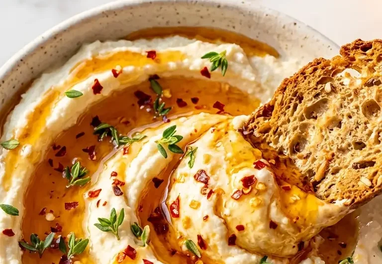 Pinterest pin image for ricotta dip with hot honey close up with golden honey drizzle