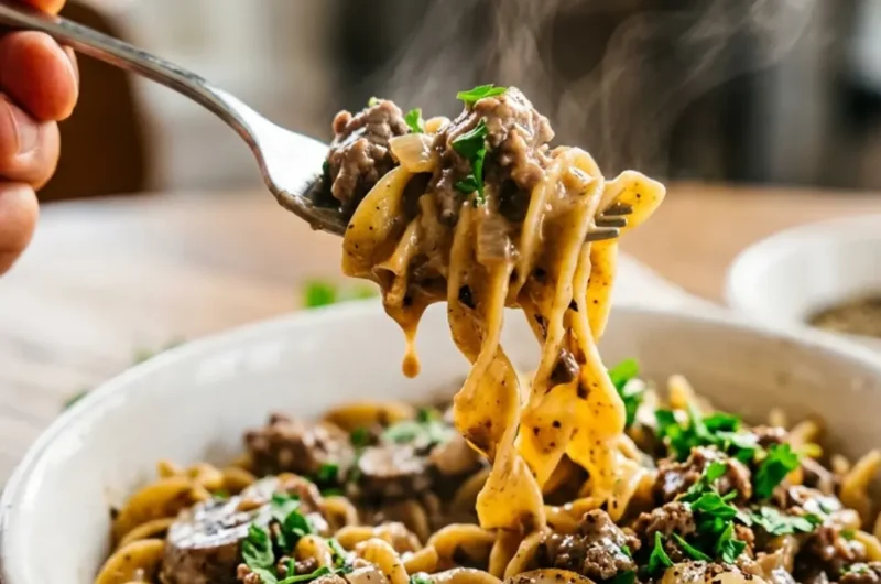 Pinterest pin image for easy ground beef stroganoff with fork lifting creamy noodles